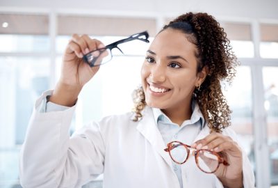 Eye care, vision and black woman, glasses choice and optometrist, healthcare for eyes with doctor a.